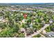 Aerial view of a single-Gathering home surrounded by mature trees in a suburban community at 1100 E Harvey St, Castle Rock, CO 80108