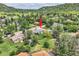 A charming house with a well-manicured lawn, nestled in a verdant neighborhood with mountain views at 1100 E Harvey St, Castle Rock, CO 80108