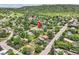 An aerial image of a home in a tree-lined suburban neighborhood near a mountain landscape at 1100 E Harvey St, Castle Rock, CO 80108