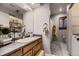 Bathroom featuring an open-concept shower, sink, and a stacked washer/dryer combo at 1100 E Harvey St, Castle Rock, CO 80108