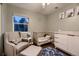A Bedroom featuring a crib, dresser, and chair at 1100 E Harvey St, Castle Rock, CO 80108