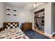 A bedroom featuring wooden furniture, hardwood floors, and a closet at 1100 E Harvey St, Castle Rock, CO 80108