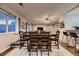 Dining room with wood table set, and large windows overlooks the backyard at 1100 E Harvey St, Castle Rock, CO 80108