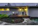Home's inviting front porch, featuring decorative door and chairs for relaxing at 1100 E Harvey St, Castle Rock, CO 80108