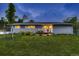 Inviting front yard with fresh green grass and cozy porch chairs and well-maintained landscaping at 1100 E Harvey St, Castle Rock, CO 80108