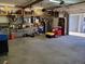 A well-lit, organized garage with shelving and ample space for storage at 1100 E Harvey St, Castle Rock, CO 80108