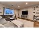 Comfortable living room featuring stylish furnishings, a TV, and a cozy sectional sofa at 1100 E Harvey St, Castle Rock, CO 80108