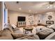 Living room featuring a sectional sofa, TV, and stylish decor with hardwood floors at 1100 E Harvey St, Castle Rock, CO 80108