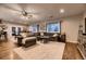 Spacious living room with a large sectional sofa, area rug, and a ceiling fan at 1100 E Harvey St, Castle Rock, CO 80108