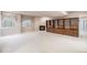 Spacious basement with fireplace and custom built-in shelving for ample storage at 13806 E Chenango Dr, Aurora, CO 80015