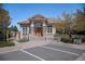 Community clubhouse features stone accents, a ramp, and plentiful parking at 13806 E Chenango Dr, Aurora, CO 80015