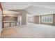 Open-concept living space showcasing vaulted ceilings and abundant natural light at 13806 E Chenango Dr, Aurora, CO 80015