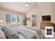 Bright main bedroom suite with large windows and ensuite bath at 13806 E Chenango Dr, Aurora, CO 80015
