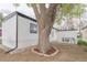 Backyard features a mature tree and utility access at 14701 E Colfax Ave # A5, Aurora, CO 80011