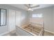 This bedroom features a ceiling fan, window, closet, and space for a queen bed at 14701 E Colfax Ave # A5, Aurora, CO 80011