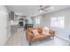 Cozy living room featuring a modern gray interior, comfortable sofa, and open-concept kitchen at 14701 E Colfax Ave # A5, Aurora, CO 80011