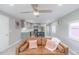 Cozy living room featuring a modern gray interior, comfortable sofa, and open-concept kitchen at 14701 E Colfax Ave # A5, Aurora, CO 80011