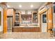 Basement bar with granite countertop and ample cabinetry at 1138 County Road 65, Evergreen, CO 80439