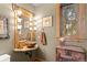 Rustic bathroom with wooden vanity, vessel sink, and large mirror at 1138 County Road 65, Evergreen, CO 80439