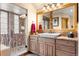 Elegant bathroom with a large vanity and glass-enclosed shower at 1138 County Road 65, Evergreen, CO 80439