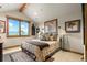 Bright bedroom with large windows and mountain views at 1138 County Road 65, Evergreen, CO 80439