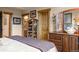 Spacious bedroom with large dresser and access to a bathroom at 1138 County Road 65, Evergreen, CO 80439