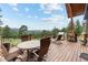 Spacious deck with mountain views, seating, and a grill at 1138 County Road 65, Evergreen, CO 80439