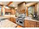 Spacious kitchen boasts a large island, professional range, and ample storage at 1138 County Road 65, Evergreen, CO 80439