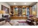 Spacious library with built-in bookshelves and window seating at 1138 County Road 65, Evergreen, CO 80439