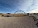 Community baseball field with benches and a dome-shaped backstop under a sunny sky at 48290 Shetland Dr, Bennett, CO 80102