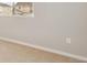 Bright bedroom featuring neutral walls, plush carpet, and a window providing ample natural light at 48290 Shetland Dr, Bennett, CO 80102