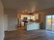 Modern kitchen with stainless steel appliances and an eat-in breakfast bar at 48290 Shetland Dr, Bennett, CO 80102