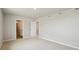 Spacious bedroom featuring a walk-in closet and attached bathroom at 48290 Shetland Dr, Bennett, CO 80102