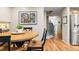 Bright dining area with hardwood floors, stainless steel refrigerator, and stairs at 11204 Eaton Way, Westminster, CO 80020