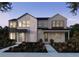 Modern two-story home with stone and siding accents at 7228 Watercress Dr, Littleton, CO 80125