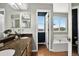 Updated bathroom with double sinks, wood floors, granite countertops, and views from the soaking tub at 30889 Manitoba Dr, Evergreen, CO 80439