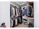Walk-in closet providing ample storage space for clothing and accessories at 30889 Manitoba Dr, Evergreen, CO 80439