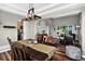 Spacious dining room connected to the kitchen and living area, ideal for entertaining at 30889 Manitoba Dr, Evergreen, CO 80439