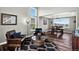 Open living space with soaring ceilings, modern decor, and seamless connection to the dining area at 30889 Manitoba Dr, Evergreen, CO 80439