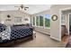 Spacious main bedroom with views, vaulted ceilings and a ceiling fan for a comfortable and inviting retreat at 30889 Manitoba Dr, Evergreen, CO 80439