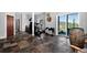 Multi-purpose space with slate tile flooring and access to the backyard at 30889 Manitoba Dr, Evergreen, CO 80439