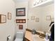 Comfortable bathroom with framed art prints and a light-colored sink at 29857 Park Village Dr, Evergreen, CO 80439