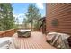 Spacious wood deck, ideal for outdoor dining and relaxation, with scenic views at 29857 Park Village Dr, Evergreen, CO 80439