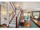 Entryway with a staircase and view of the kitchen with breakfast nook at 29857 Park Village Dr, Evergreen, CO 80439