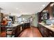 Open kitchen showcases granite countertops, dark wood cabinets, and modern appliances at 29857 Park Village Dr, Evergreen, CO 80439