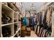 Walk-in closet with custom shelving and abundant storage, catering to organization at 29857 Park Village Dr, Evergreen, CO 80439