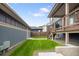 Green backyard with a porch, ideal for outdoor entertaining and relaxation at 4184 Kalamath St, Denver, CO 80211