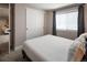 Bedroom with a large window and closet doors at 4184 Kalamath St, Denver, CO 80211