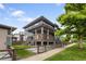 Stylish two-story home with a spacious porch overlooking the yard at 4184 Kalamath St, Denver, CO 80211