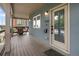Inviting covered front porch with stylish seating and modern exterior details at 4184 Kalamath St, Denver, CO 80211
